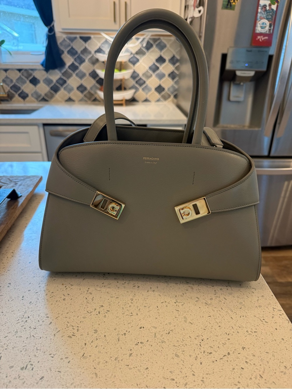 BRAND NEW NEVER WORN Ferragamo Grey Hug Bag with Gold Hardware